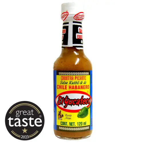Bottle of El Yucateco hot sauce with a Great Taste award logo on a white background