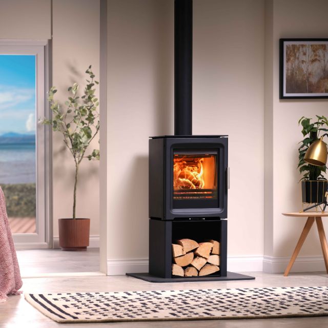 Wood-burning stove in a room with a view of the sea