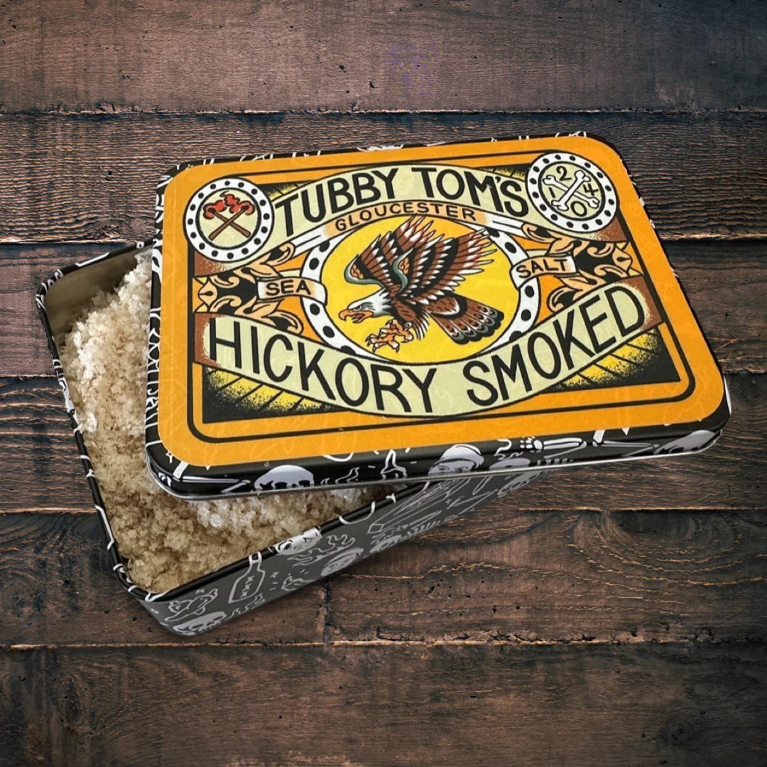 Tubby Tom's Hickory Smoked salt packaging on a wooden surface