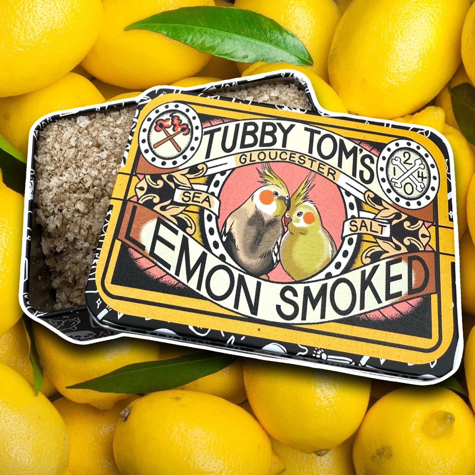 Tubby Tom's lemon smoked salt packaging with a background image containing lemons