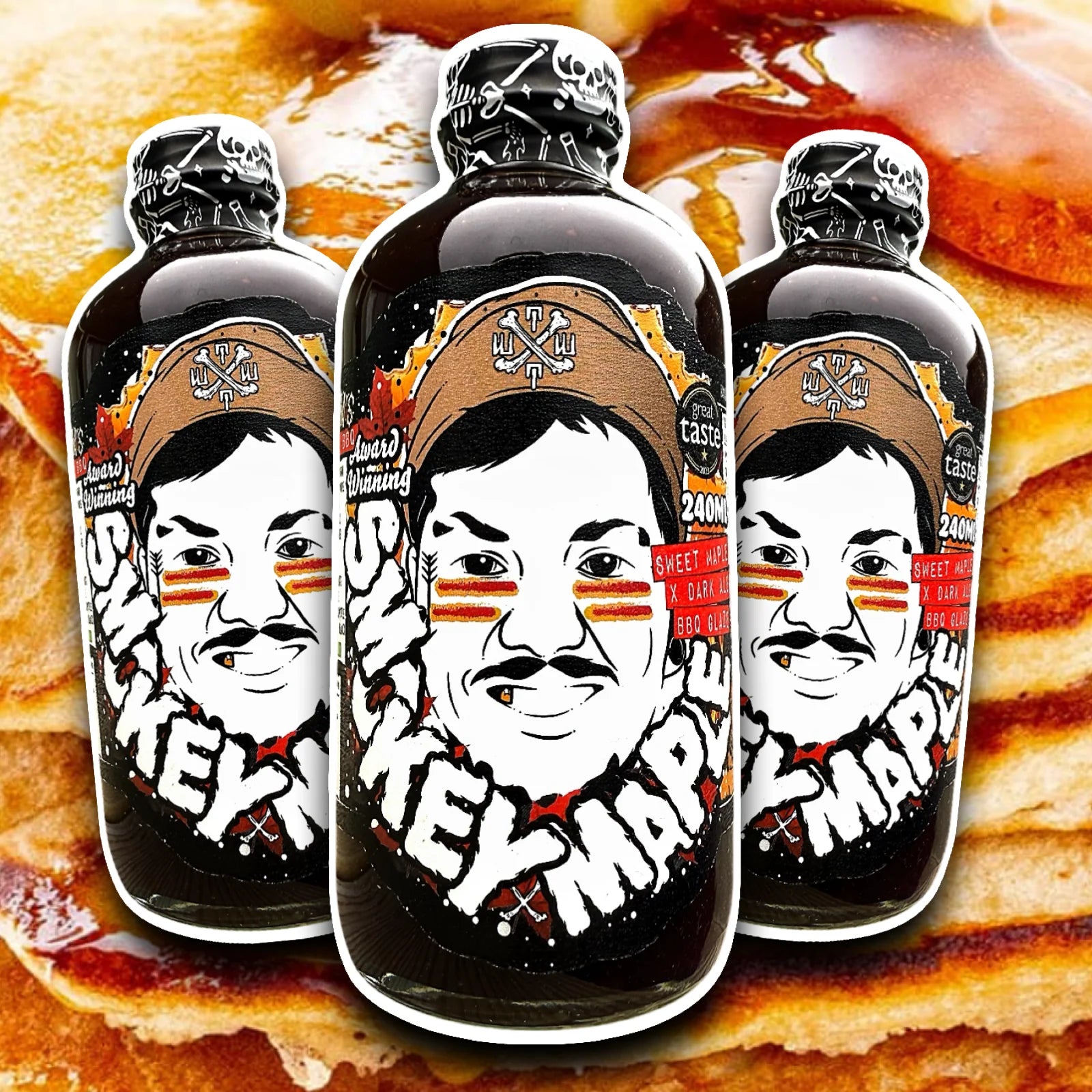 Three Bottles of Smokey Maple BBQ Sauce on a background of pancakes