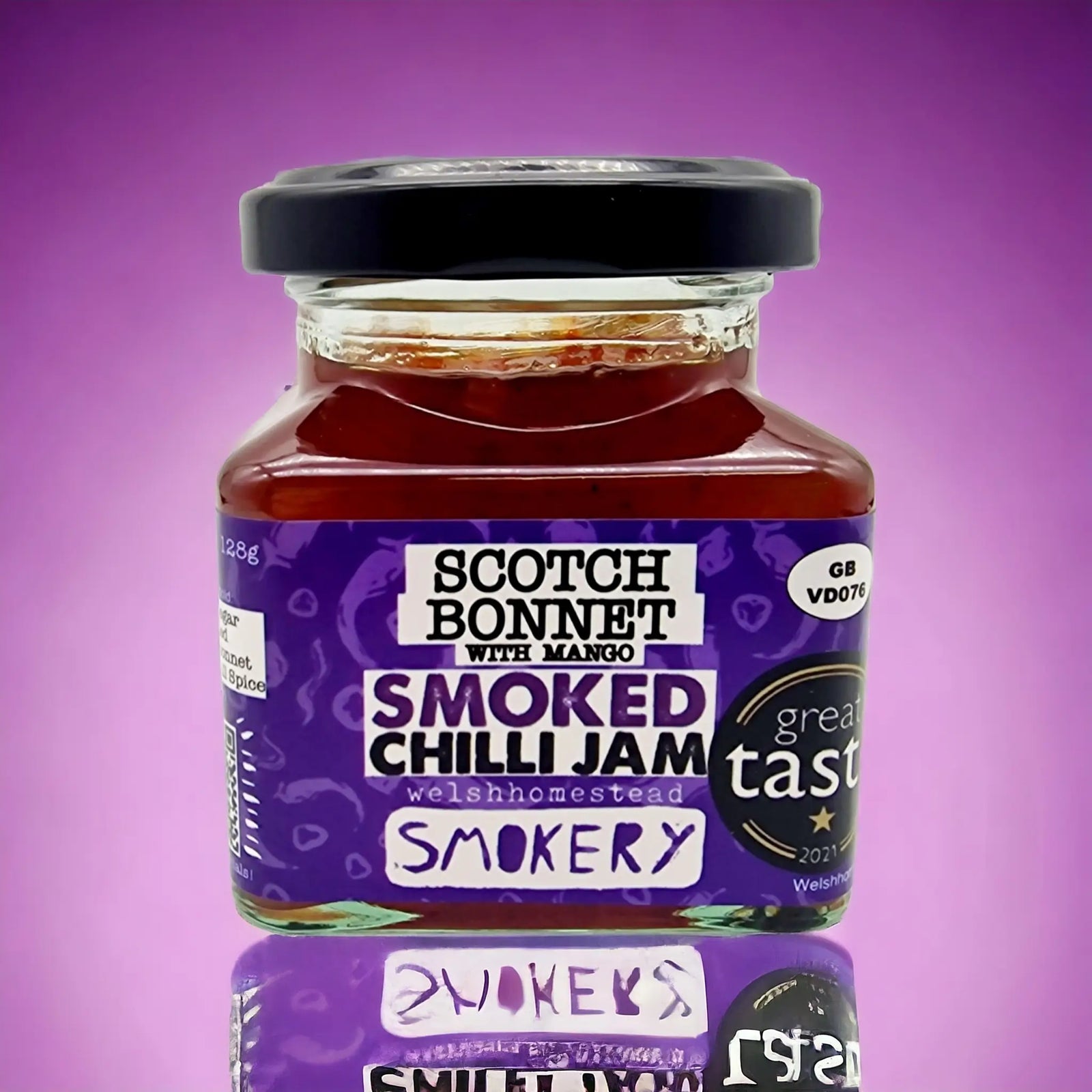 Jar of Smoked Chilli Jam with a purple label on a purple background