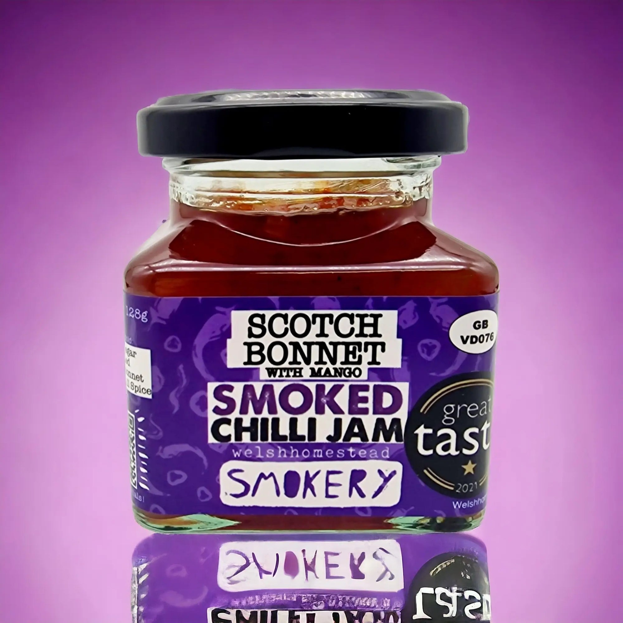 Jar of Smoked Chilli Jam with a purple label on a purple background