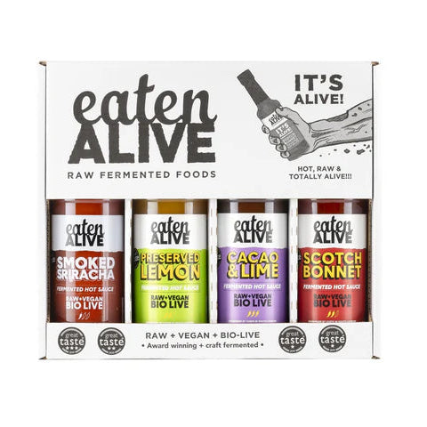 Box of 'eaten ALIVE' raw fermented sauces with various flavors on a white background