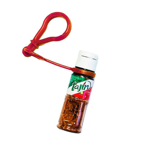 Tajin seasoning bottle with a red keychain on a white background