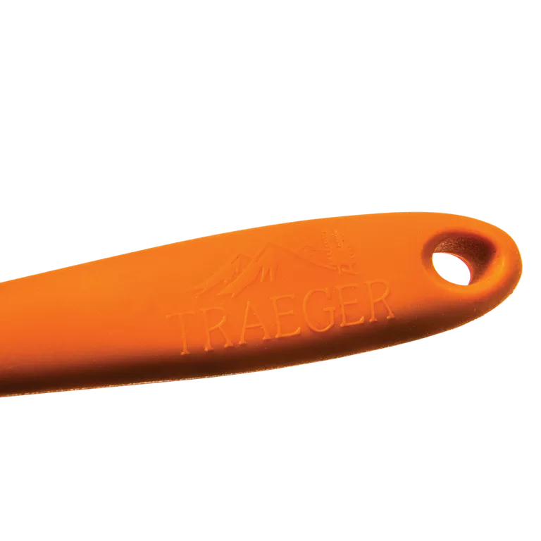 Orange tool handle with 'Traeger' branding on a white background