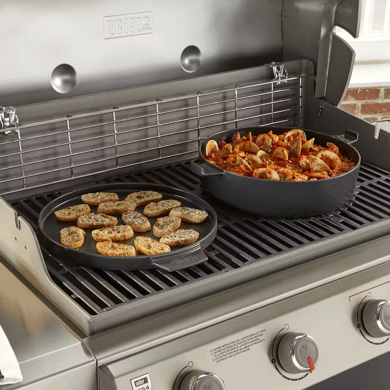 Weber Dutch Oven Duo being used to cook two different foods separately over a gas Weber grill