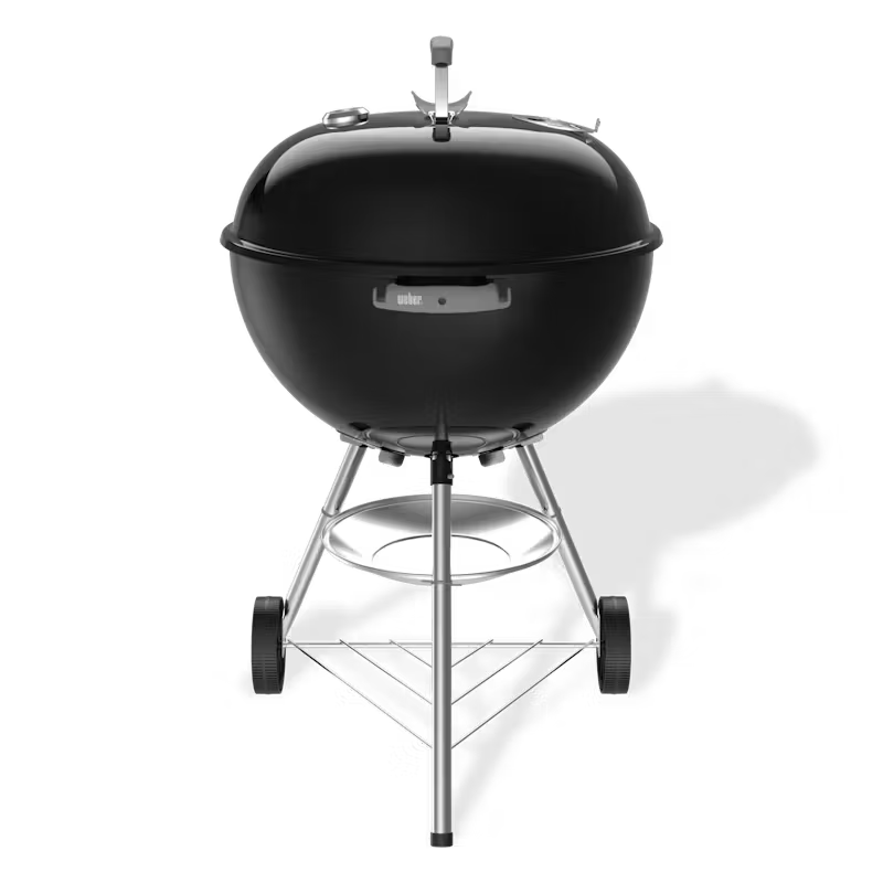 Black Weber kettle grill on a white background