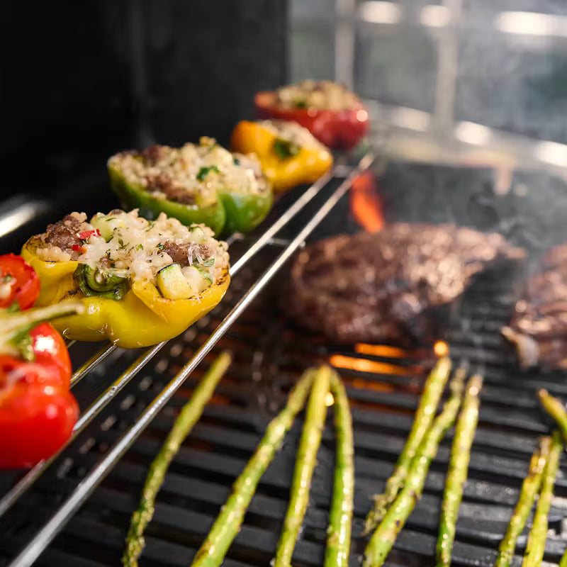 Grilled vegetables and meat on a barbecue grill
